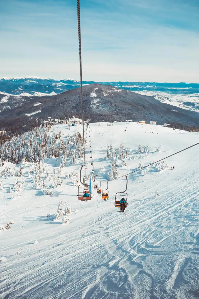 A chairlift over a snowy slope